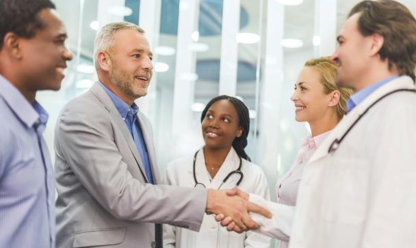 doctor and patient shaking hands