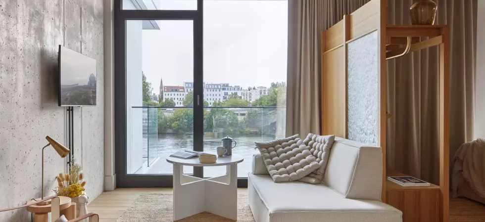 Locke at East Side Gallery, hotel room with view at couch and balcony