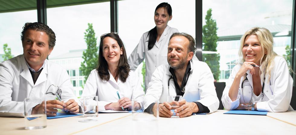 doctors sitting around a table