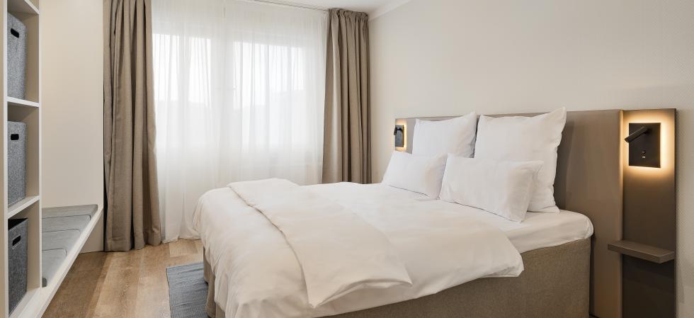 Schlafzimmer in den Apartments am Brandenburger Tor in Berlin