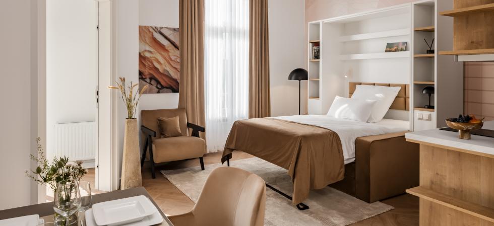 Bed room in beige at apartment FU.life on Kurfürstendamm in Berlin