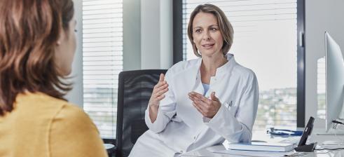 Doctor talking with her patient